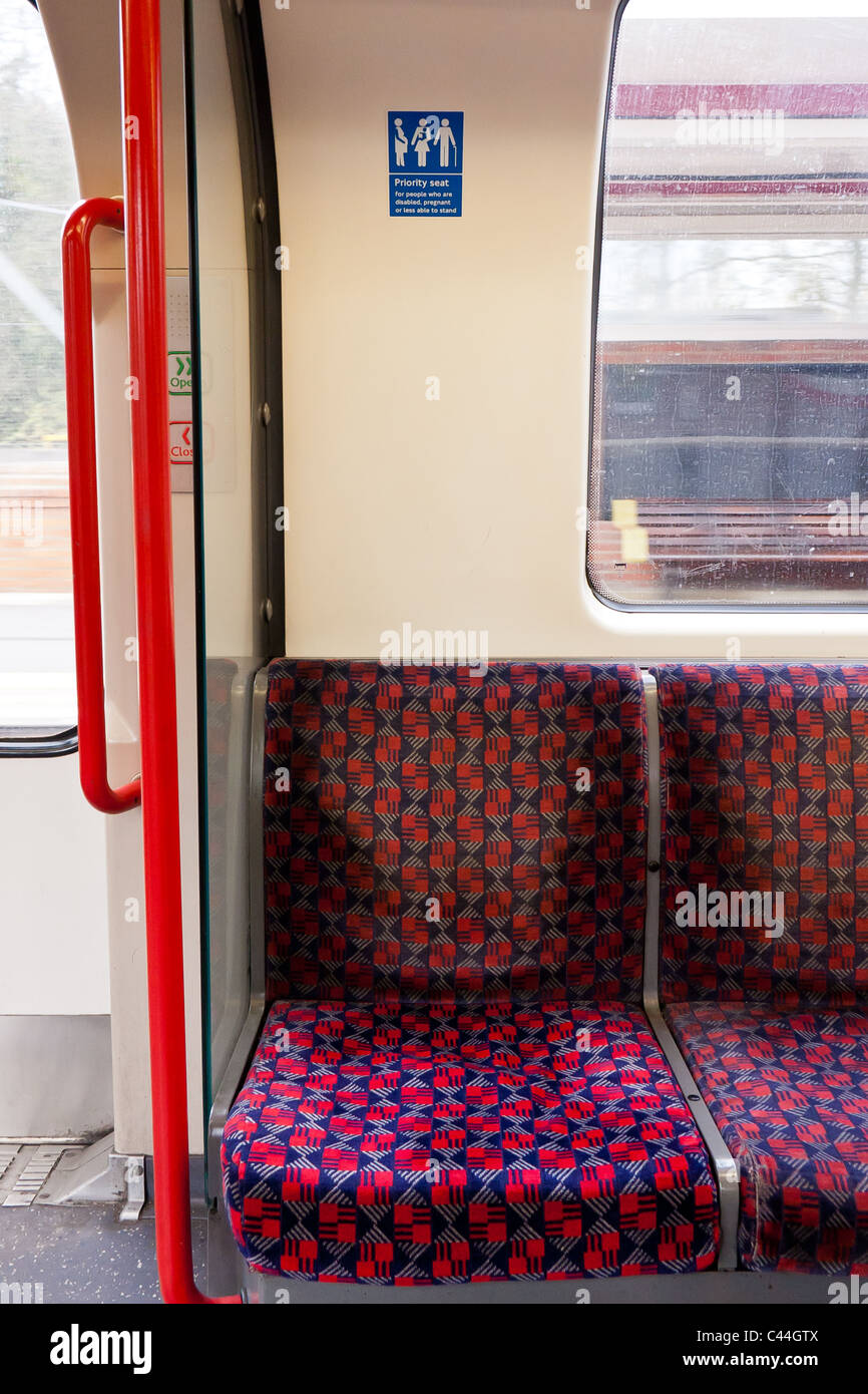 Priority seat on the Underground Central Line Stock Photo