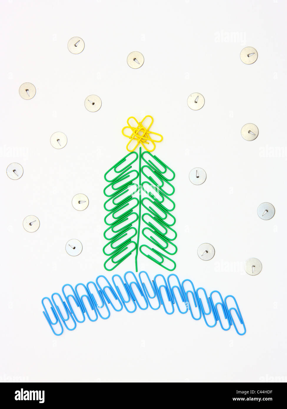 Christmas fur-tree from paper clips for a paper on a white background Stock Photo
