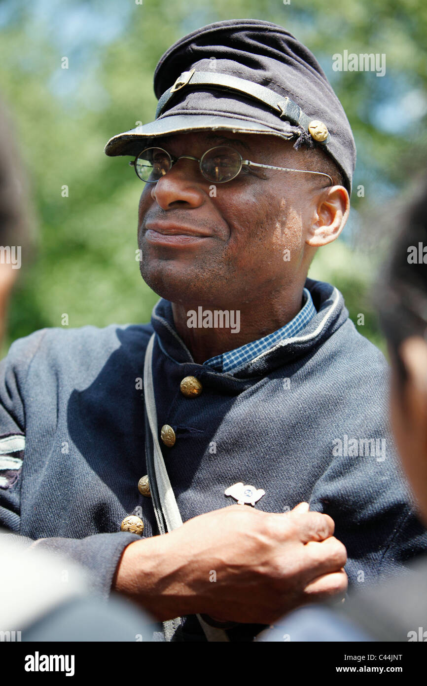 Reenactor in the uniform of the 54th Massachusetts Volunteer Infantry Regiment, an all black unit in the American Civil War Stock Photo