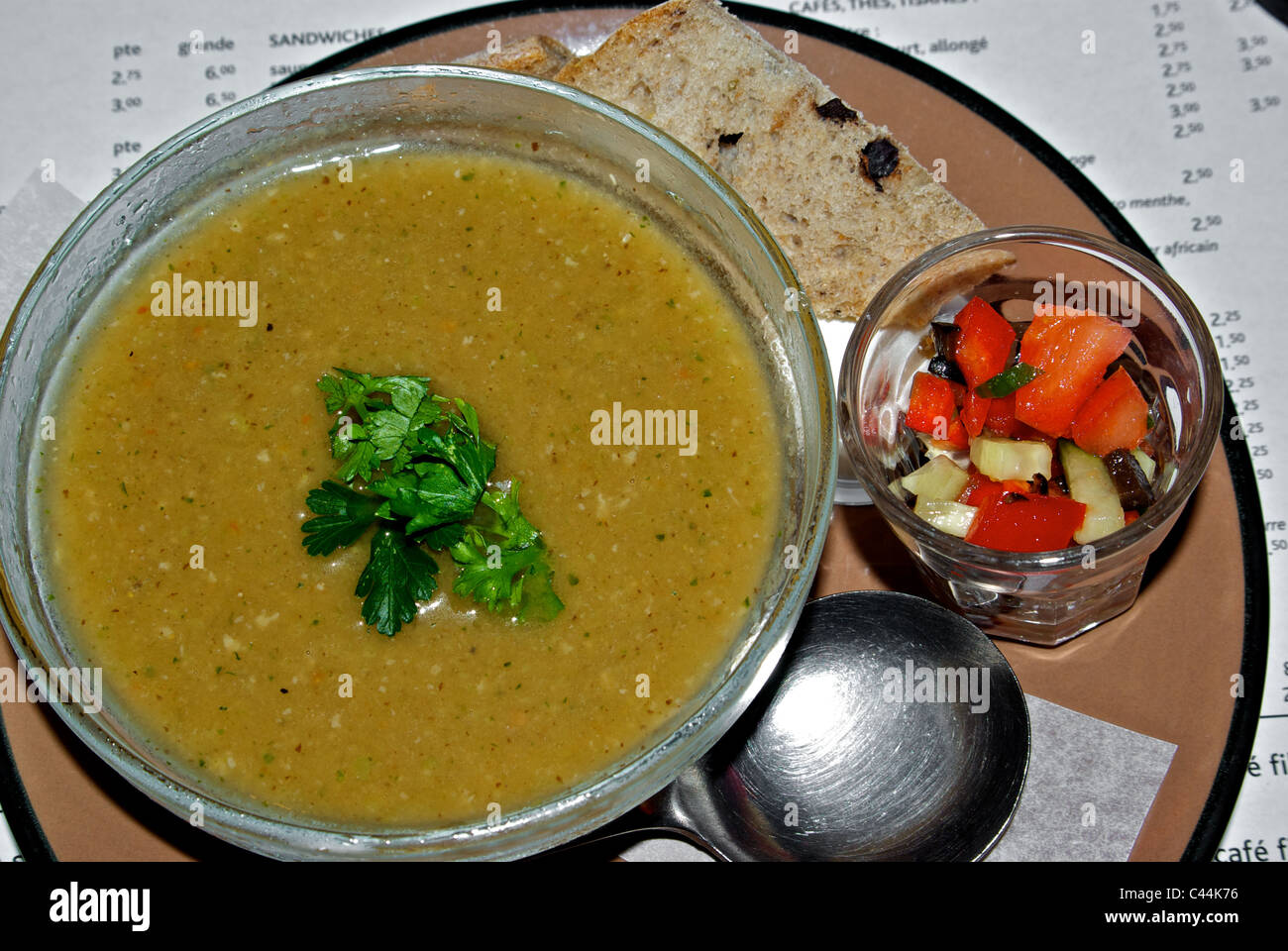 Hearty thick chunky beef vegetable soup chopped parsley garnish side