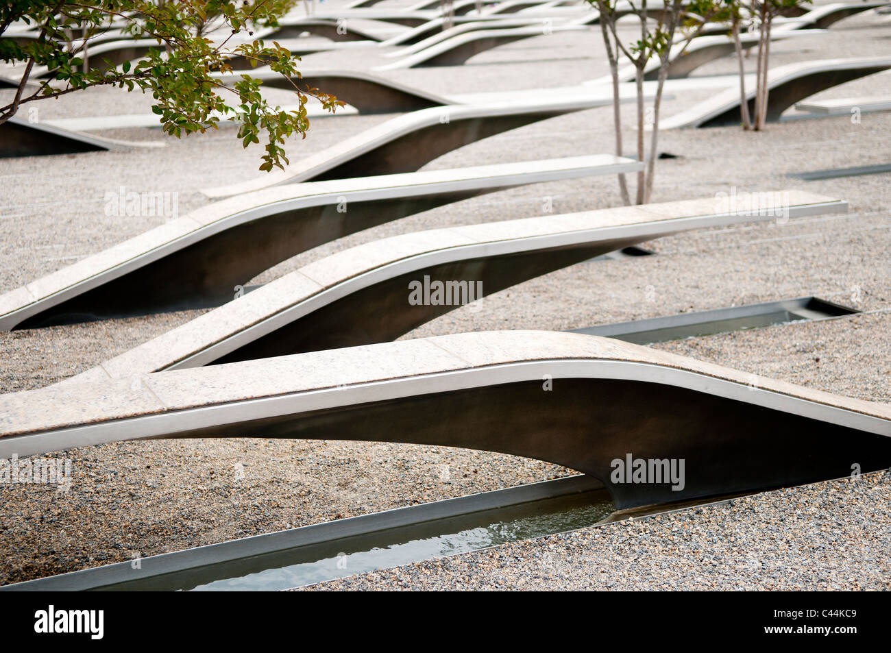 The Pentagon Memorial is in remembrance of the events of September 11, 2001, and the 184 people who died as victims of the terrorist attack on the Pentagon. The Memorial is adjacent to the southwest side of the Pentagon. Designed by Julie Beckman and Keith Kaseman, the memorial opened to the public on September 11, 2008, it is designed with one illuminated for each victim of the attack, arranged by the person's age. Each bench has a small pond of water underneath, and a name is etched on the end of each bench. Stock Photo