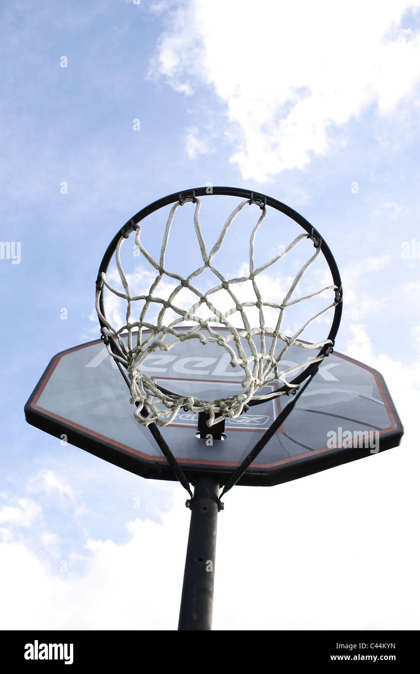 reebok basketball net against bright cloudy sky Stock Photo