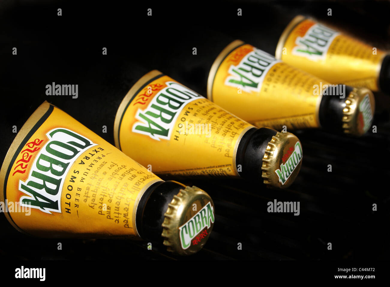 bottles of cobra laid in a row in fridge Stock Photo