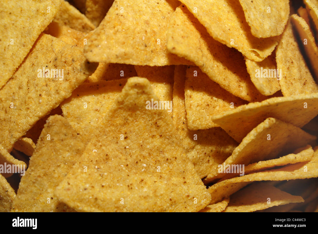 close up image of yellow salty nachos Stock Photo