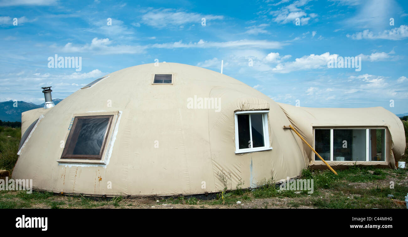 This energy efficient "monolithic dome" house is made using a vinyl dome and layers of foam