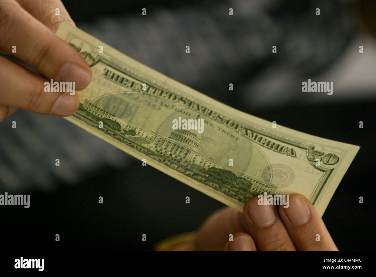 Fake American dollar bank notes, and diagrams of them, on display by