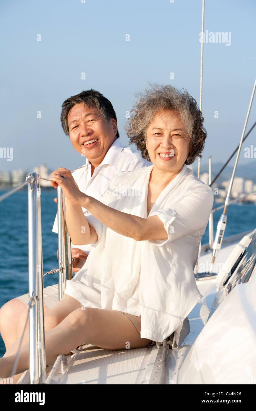 Senior Couple Sitting on the Deck Stock Photo - Alamy