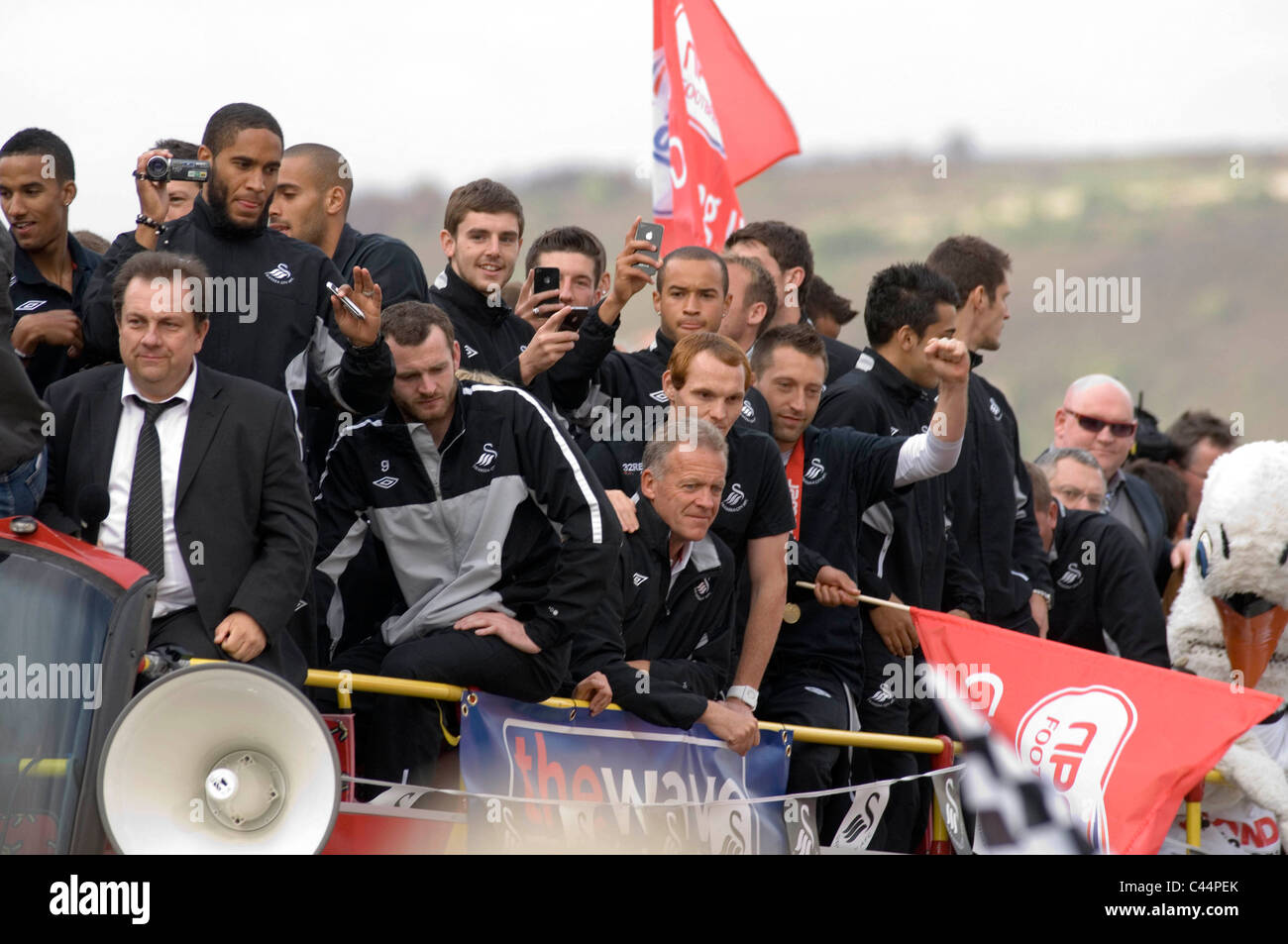 Swansea City Football Club players and staff celebrating their promotion to the Premier League