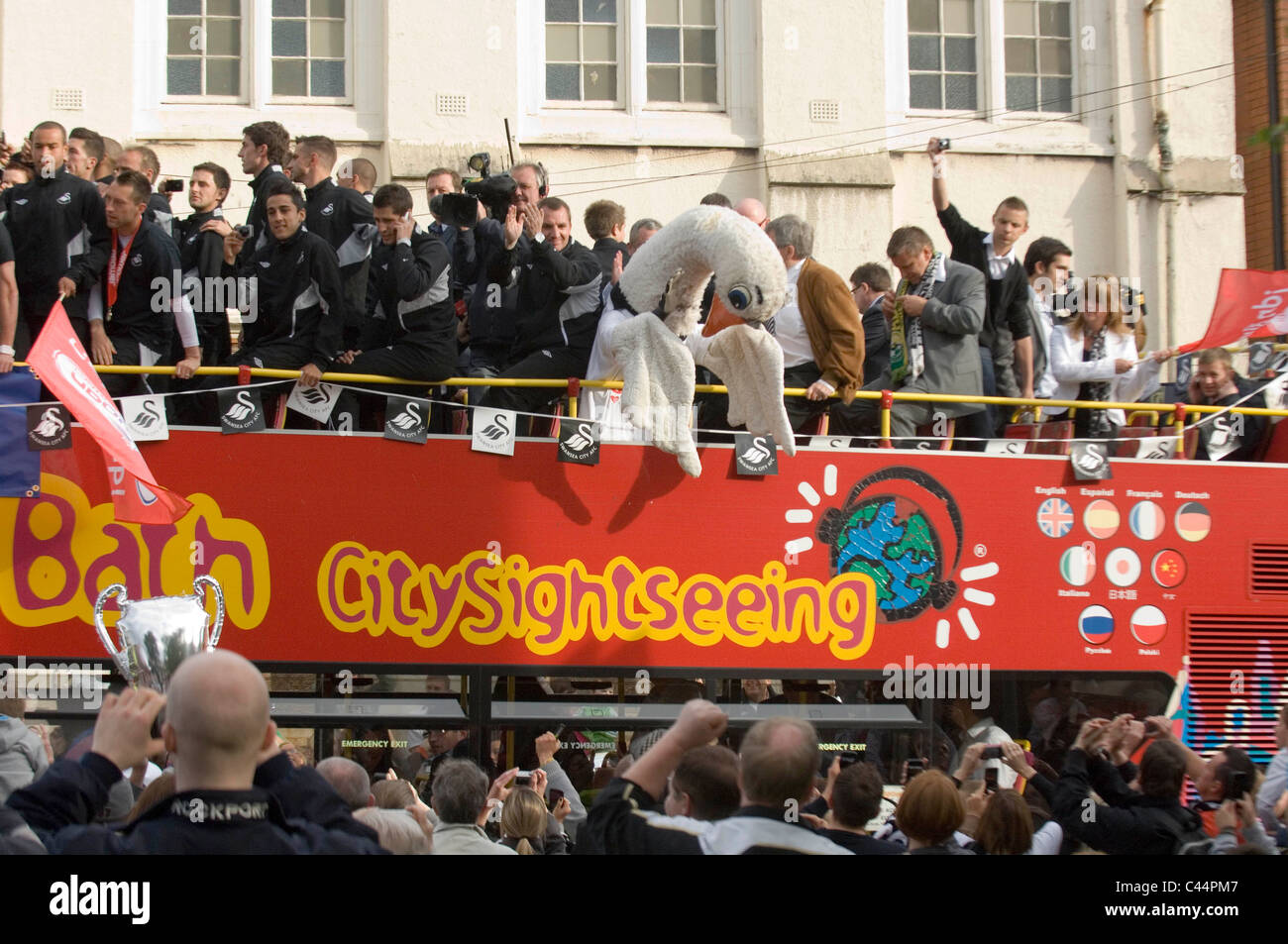 Swansea City Football Club players and staff celebrating their promotion to the Premier League