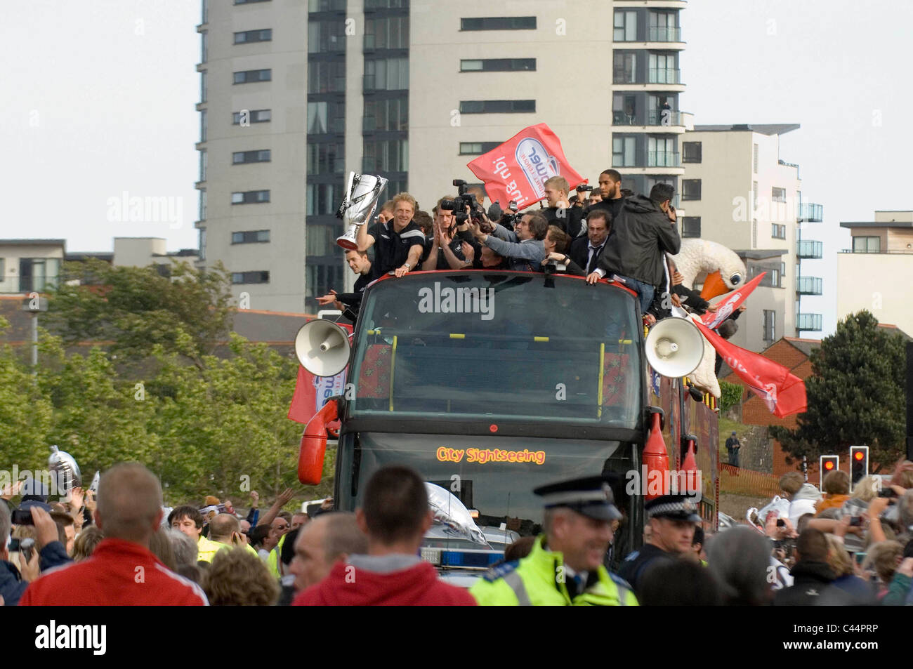 Swansea City Football Club players and staff celebrating their
