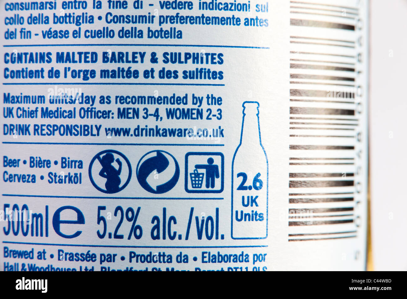 Food labelling on a bottle of beer, showing alcoholic content, units, consumption recommendations and recycling logos. Stock Photo