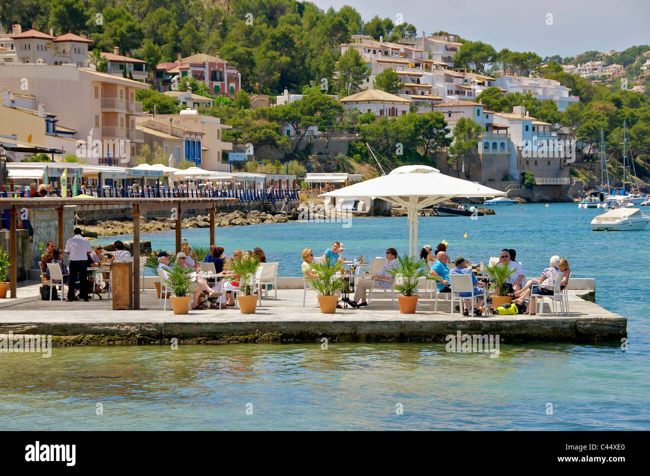 Mallorca Andratx Port Balearic. Relaxing under a parasol on the quayside. Stock Photo
