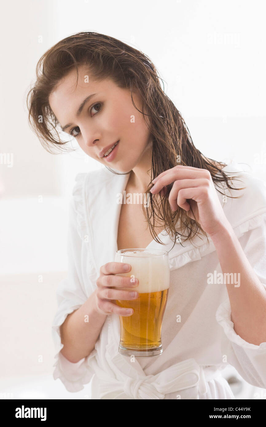 Woman using beer as hair conditioner Stock Photo Alamy