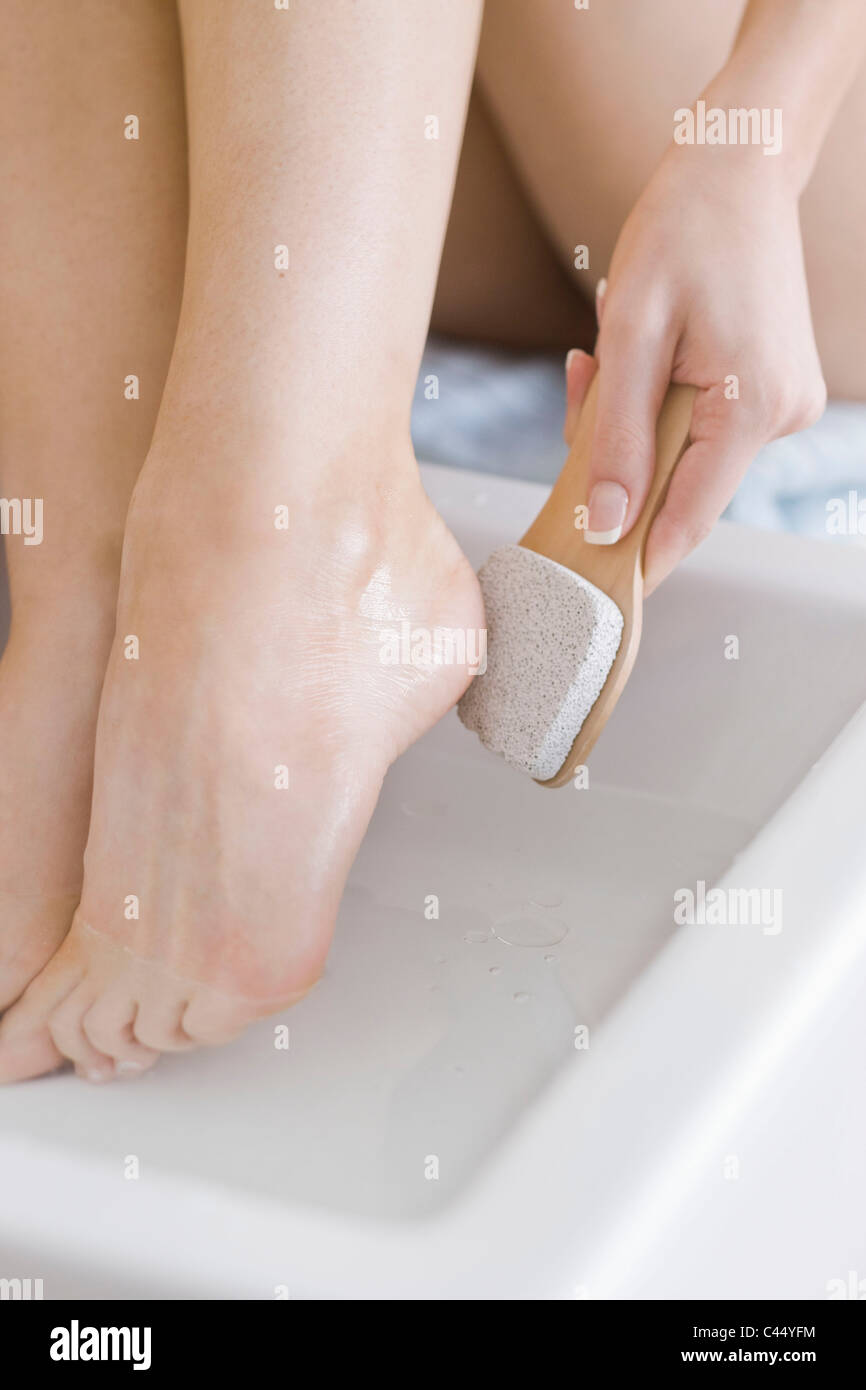woman using feet pumice Stock Photo