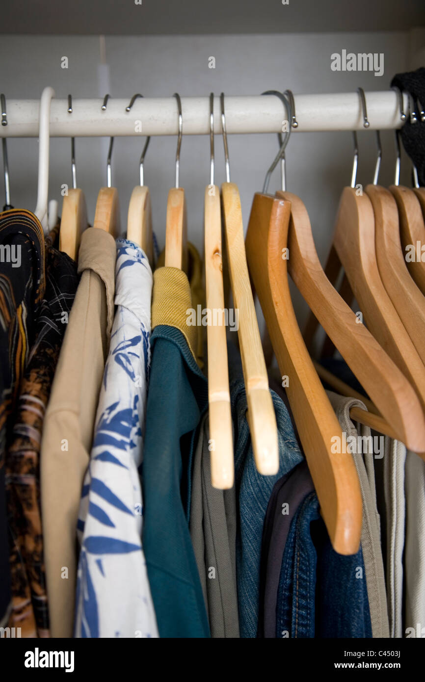 Man´s pants and sweater hanging on hooks on the back of his bedroom door  Stock Photo - Alamy