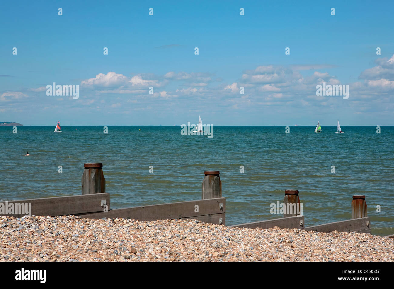 UK, England, Kent, Whitstable, view of sea with breakwaters, sailboats