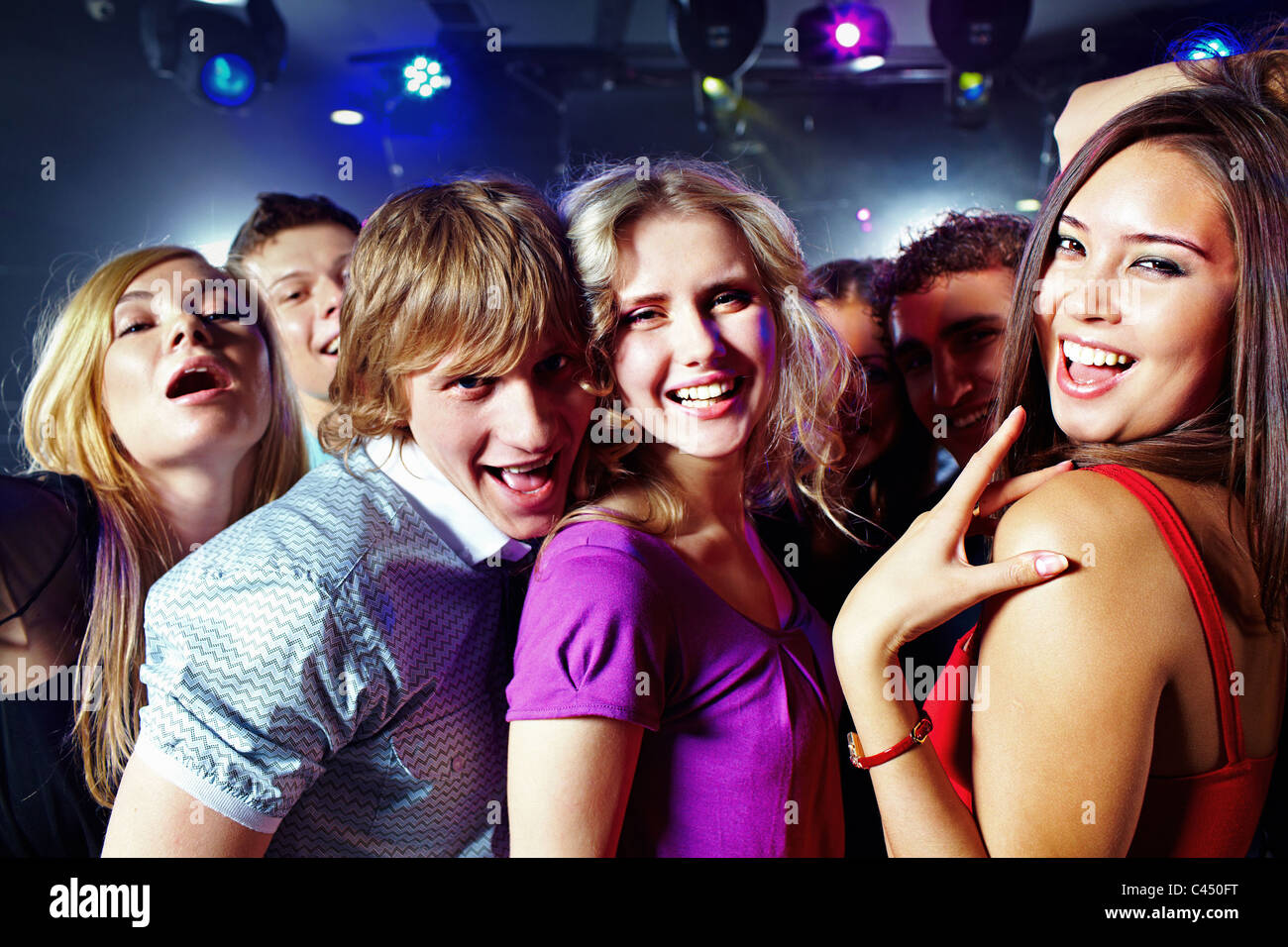 Image of clubbing friends looking at camera during party Stock Photo ...