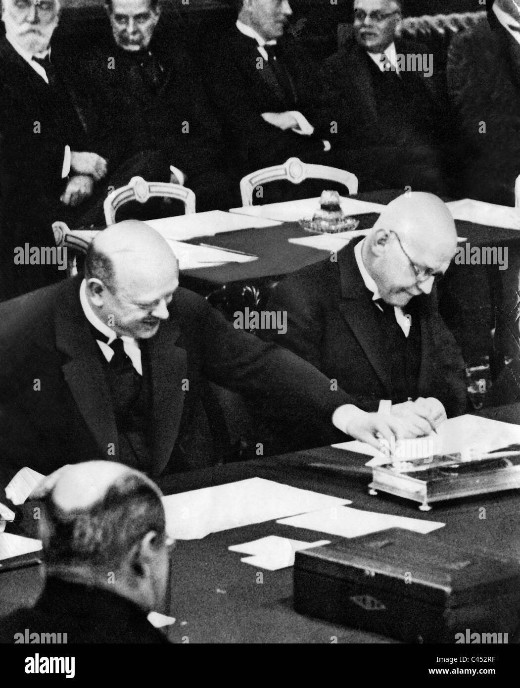 Gustav Stresemann and Hans Luther sign the Locarno Treaties, 1925 Stock Photo