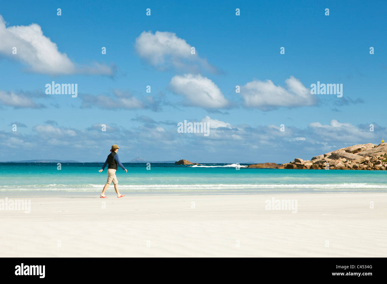Woman walking along Twilight Beach. Esperance, Western Australia, Australia Stock Photo