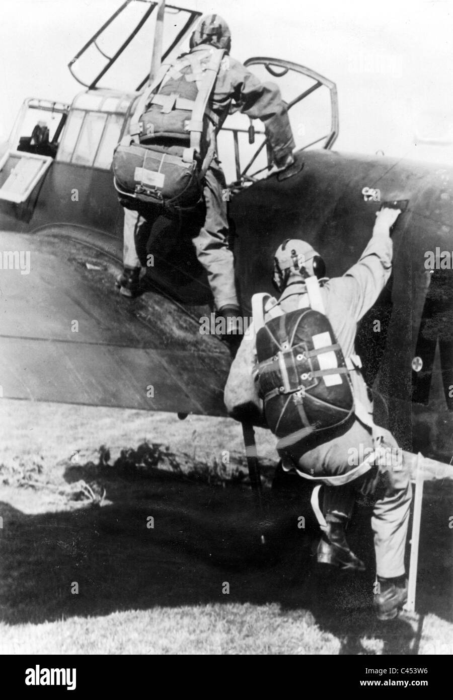 Air crew of a German Stuka climb in thier plane, 1939 Stock Photo