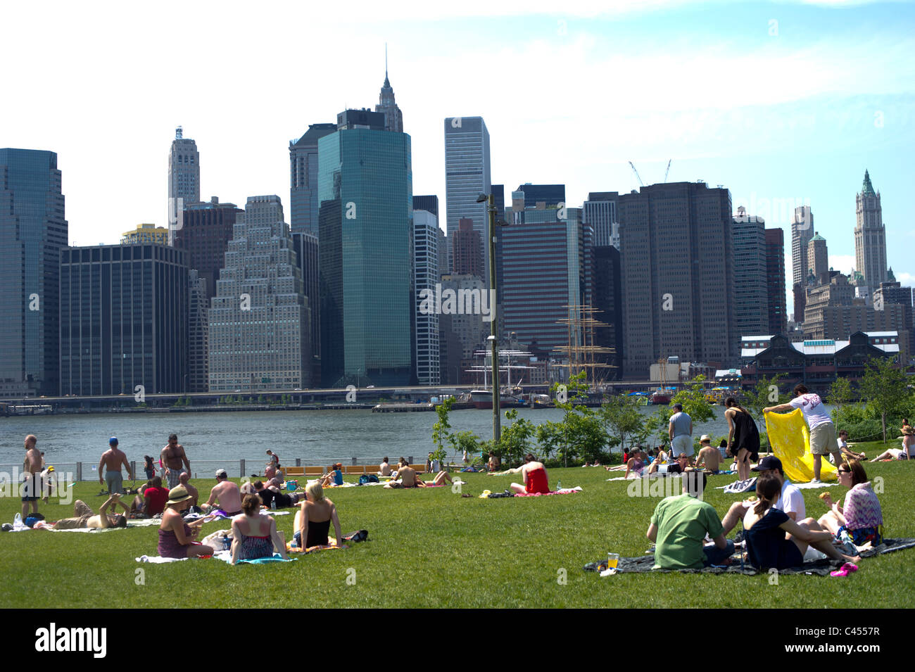 Park goers relax on a hot, humid Memorial Day in Brooklyn Bridge Park ...