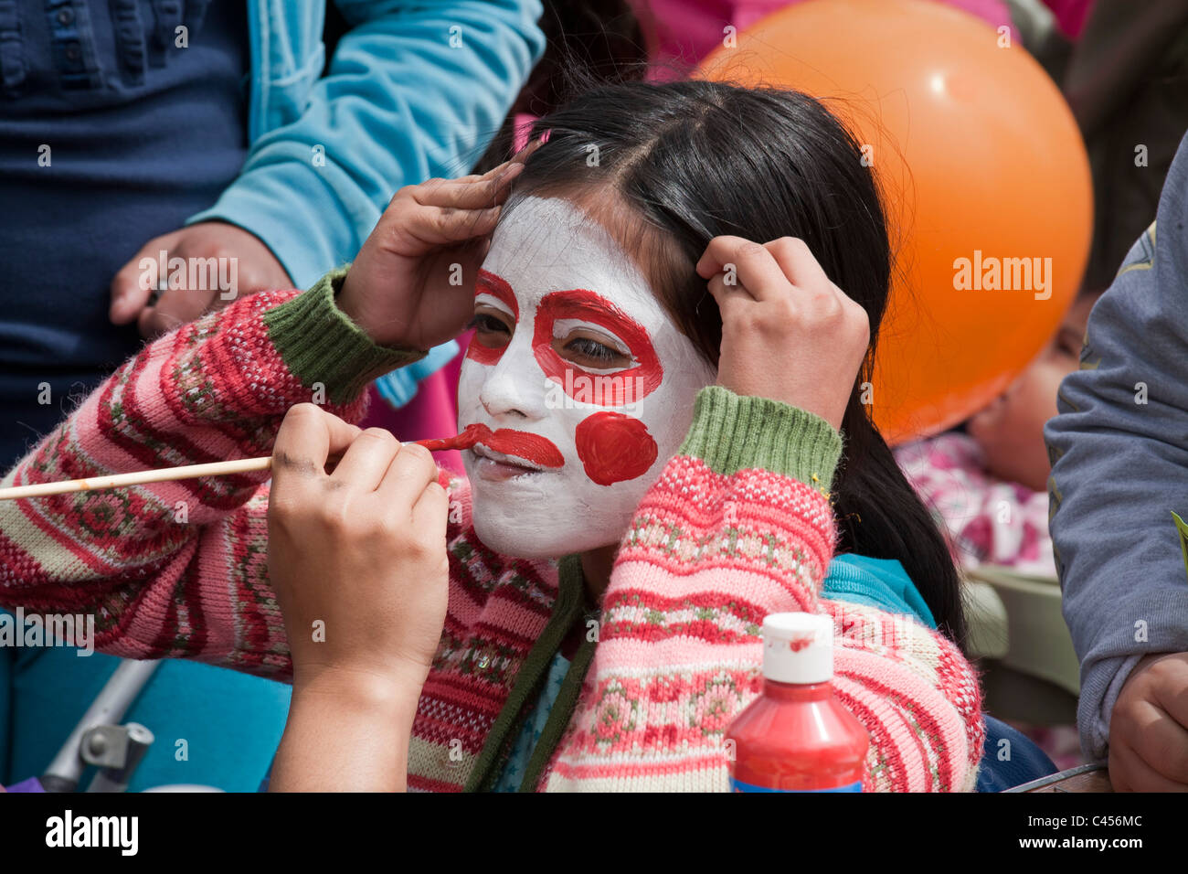 Detroit, Michigan - A girl gets her face painted at Dia de Los Niños, a children's fair in a Mexican-American neighborhood. Stock Photo