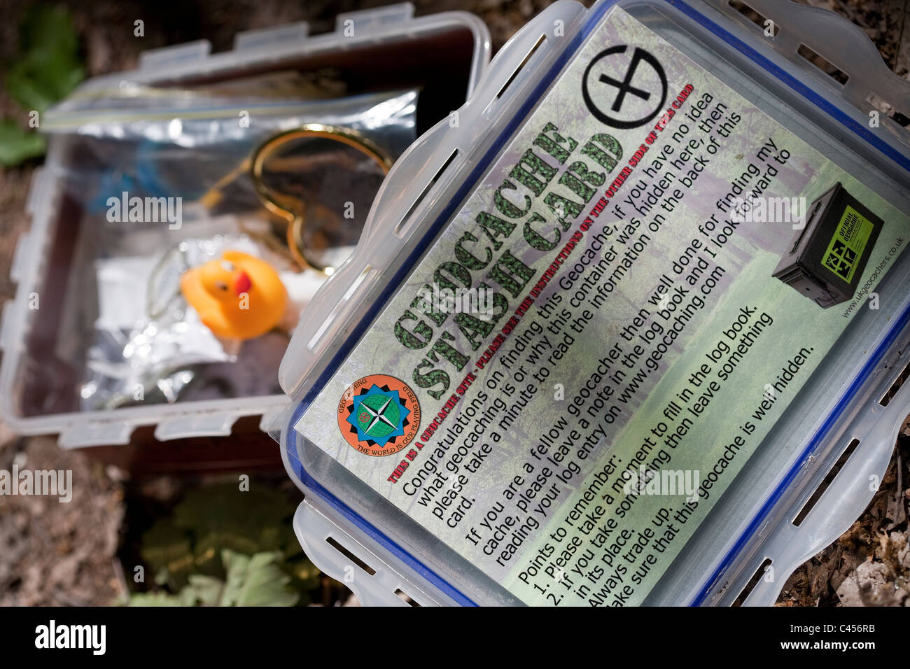 An open Geocache box showing contents Stock Photo Alamy