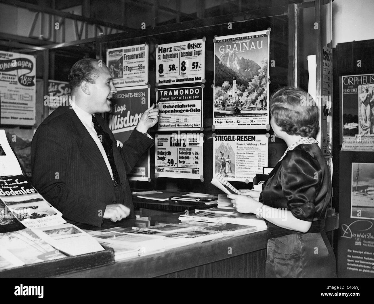 Advice in the travel agency, 1938 Stock Photo