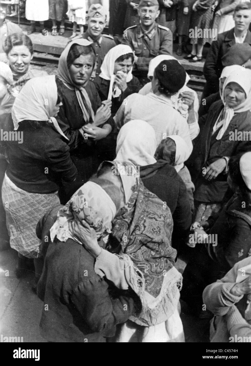 Ukrainian female slave laborers say goodbye to their relatives at the train station, 1942 Stock Photo