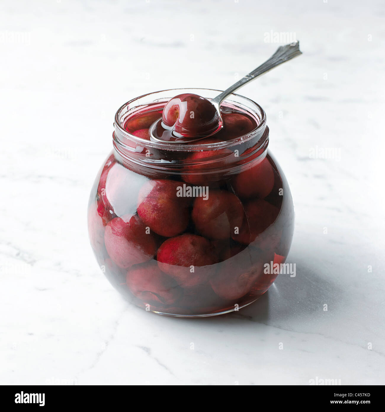 Cherries with brandy in jar, closeup Stock Photo Alamy