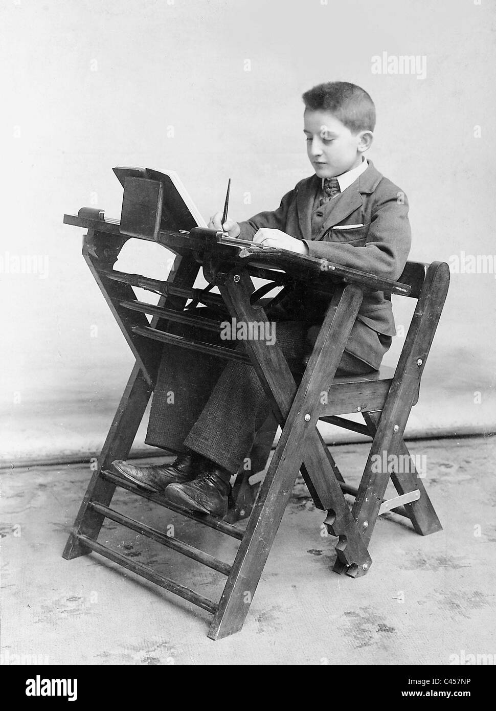 Student at a desk, 1907 Stock Photo