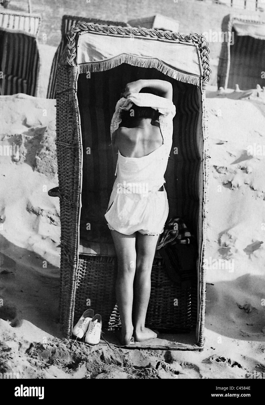 Beach chair as changing cabin, 1926 Stock Photo