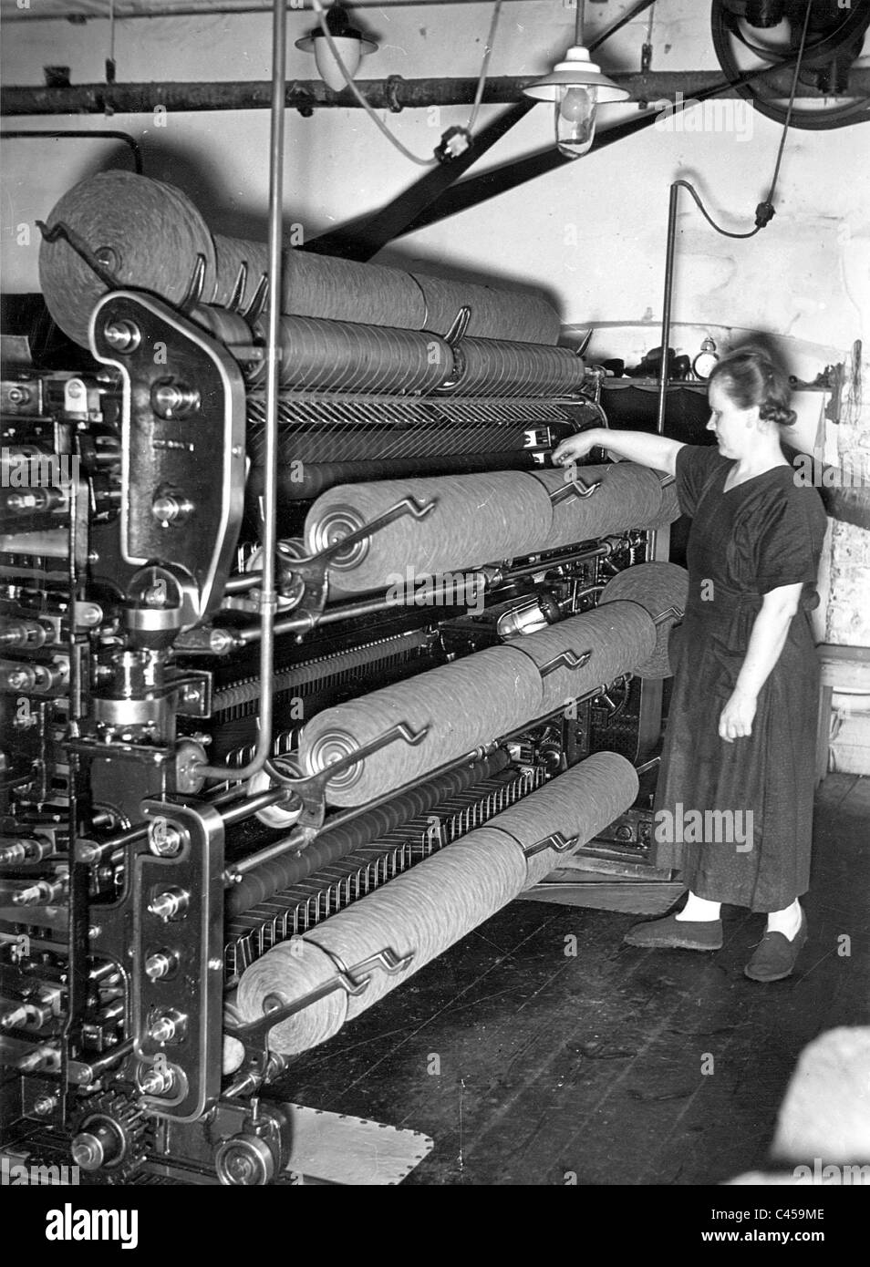 Woman in a weaving mill, 1941 Stock Photo