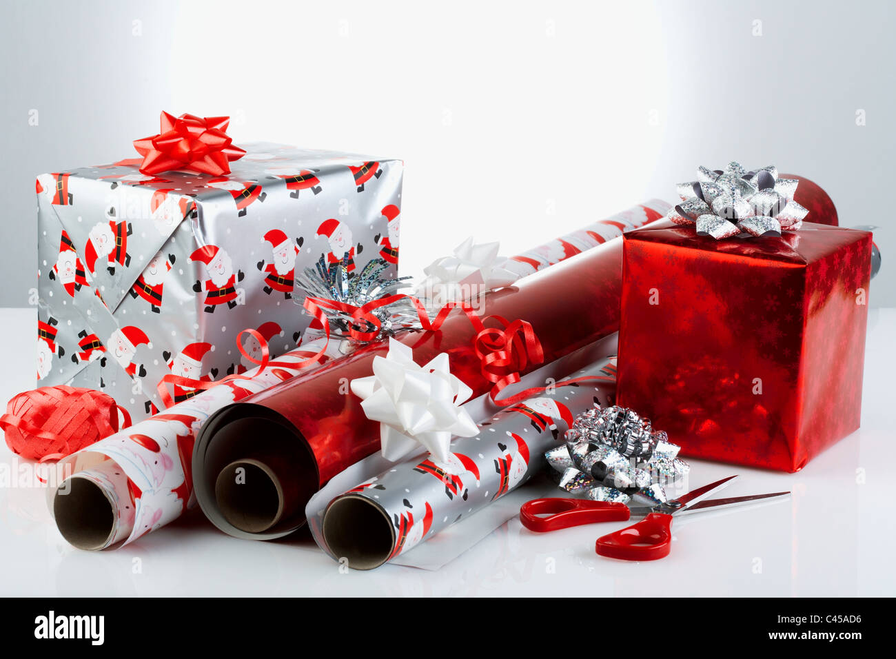 Christmas gifts with wrapping paper and scissors, close-up Stock Photo