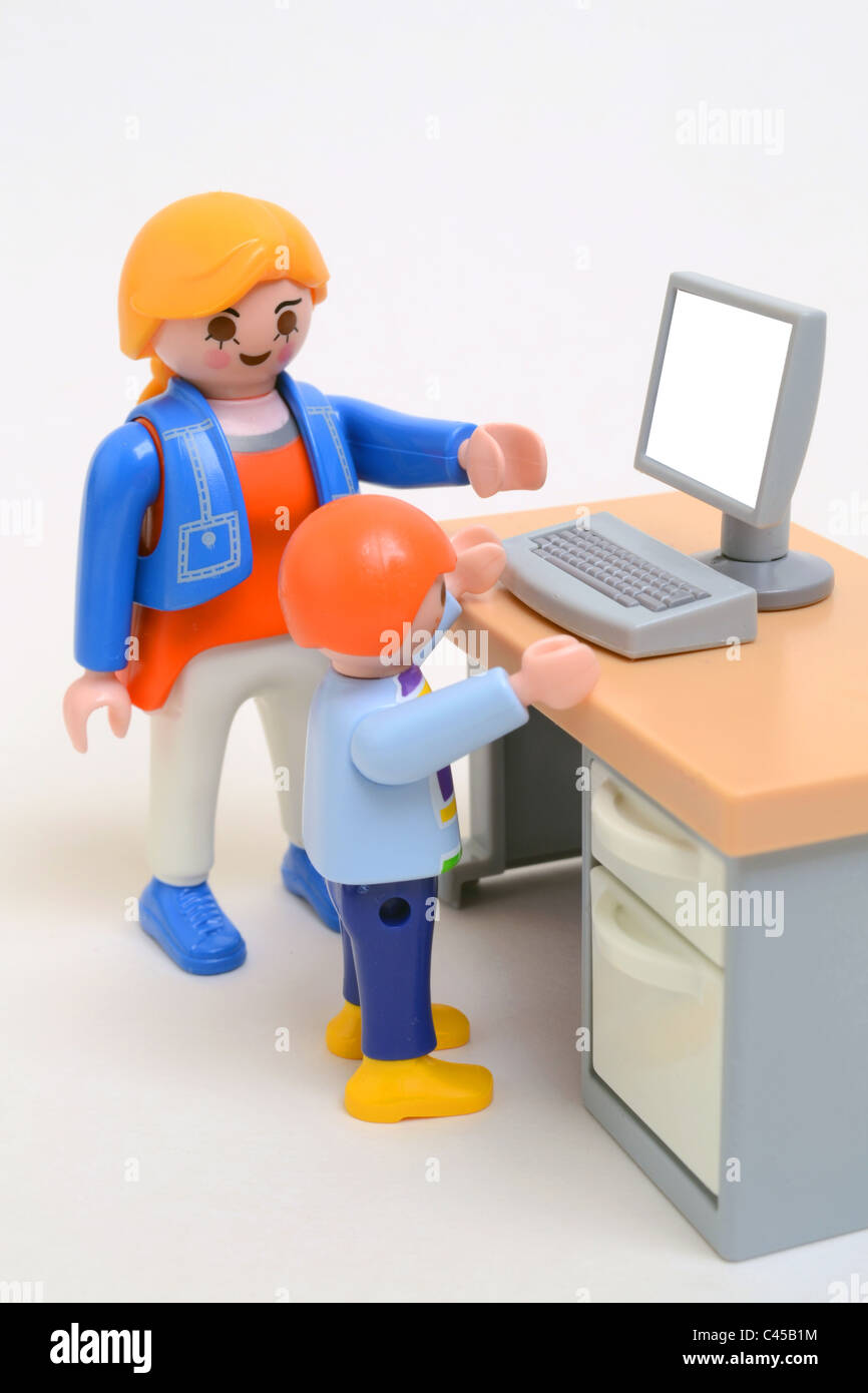 Parent mother child playing on the computer Playmobil toys concept image  Personal computing desktop computer Stock Photo - Alamy