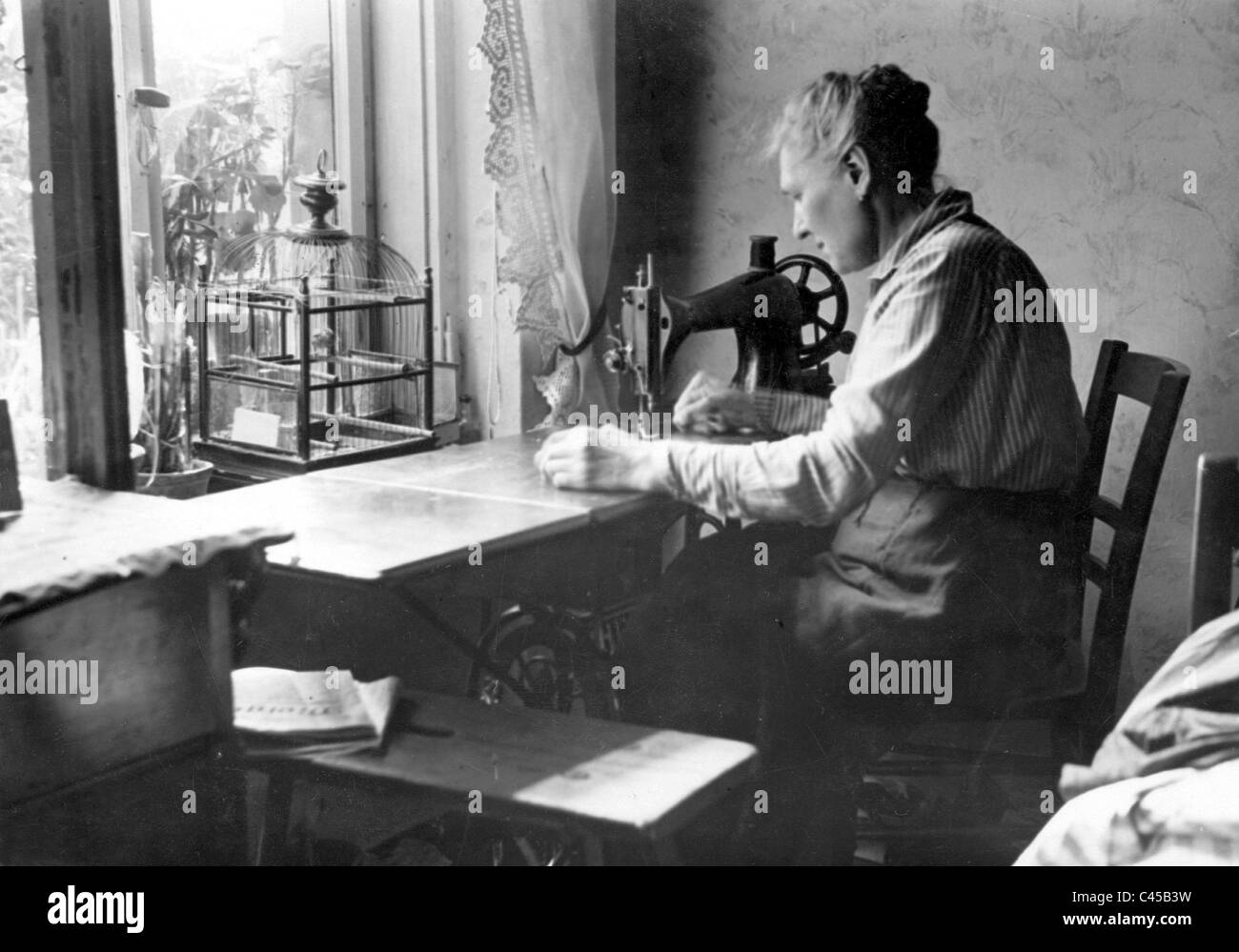 Woman working from home, 1931 Stock Photo