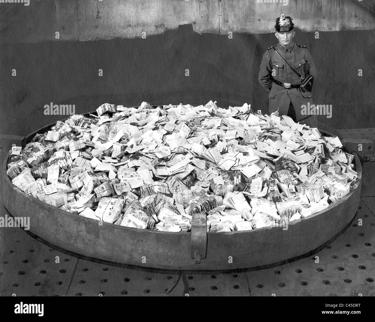 Policeman guards bills during the inflation Stock Photo Alamy