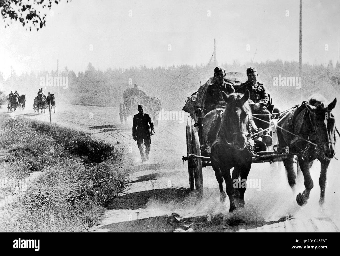 A horse-drawn carriage transports supplies Stock Photo