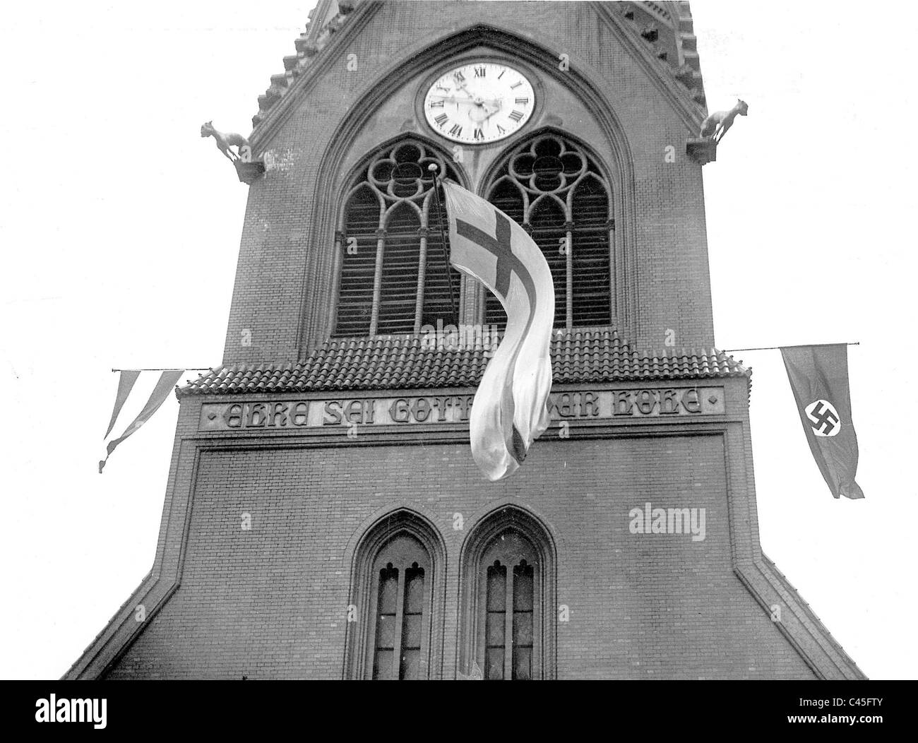 Swastika flag and church flag on the Lazarus Church in Berlin, 1933 Stock Photo