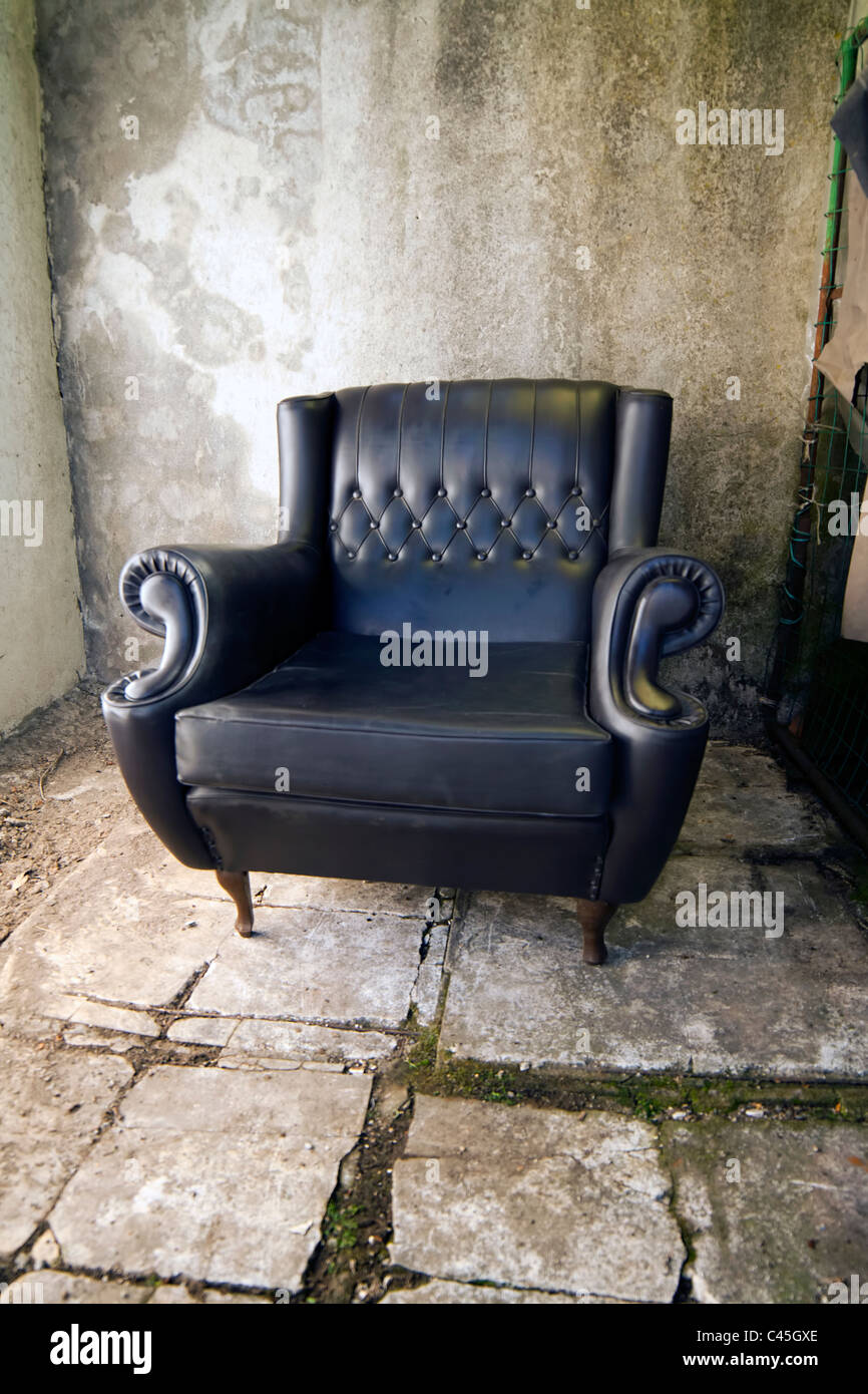 black leather armchair retro style Stock Photo Alamy