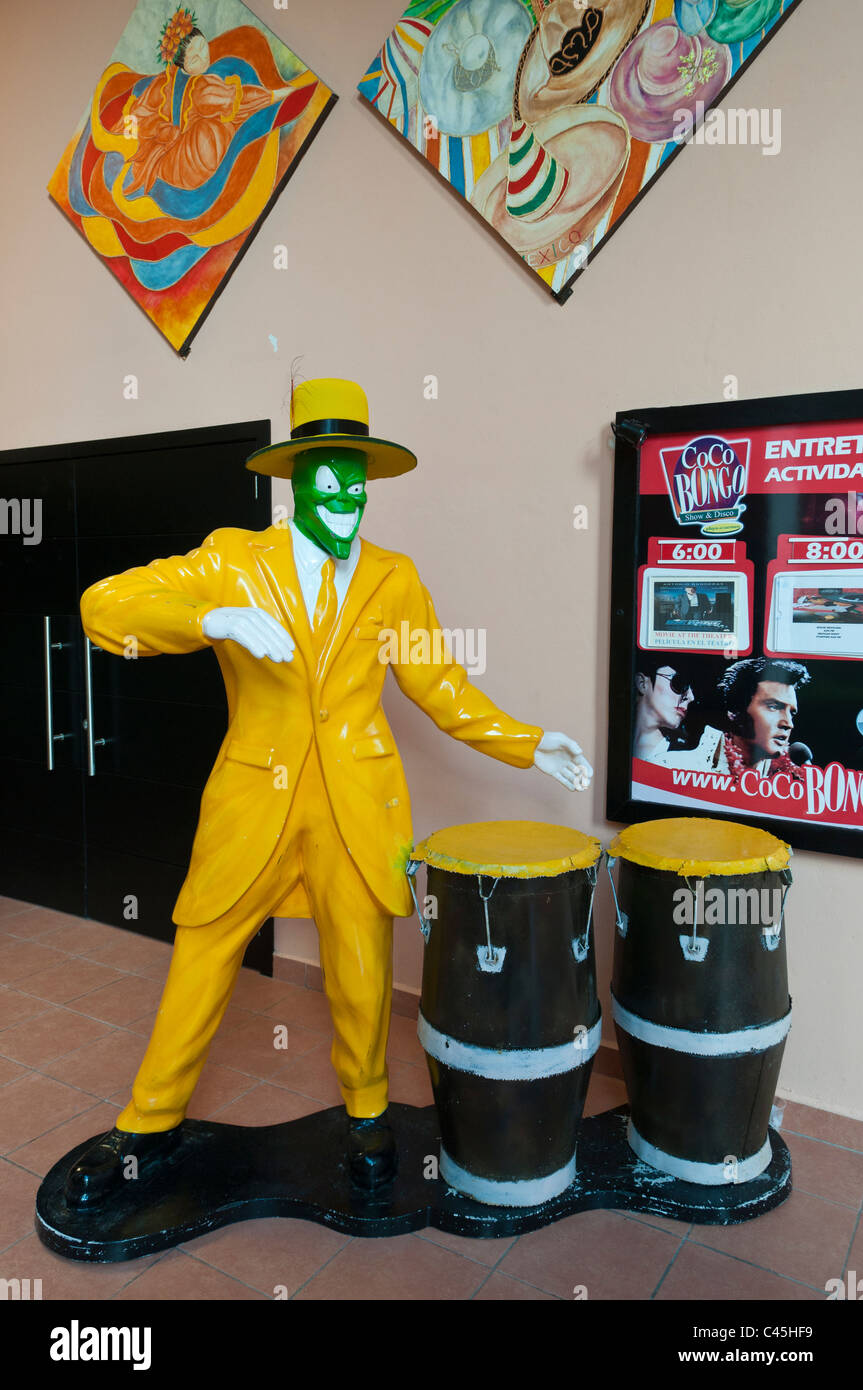 The sculpture of a brightly colored bongo player jazzes up the outside of a theater at a vacation resort on the Mayan Riviera Stock Photo