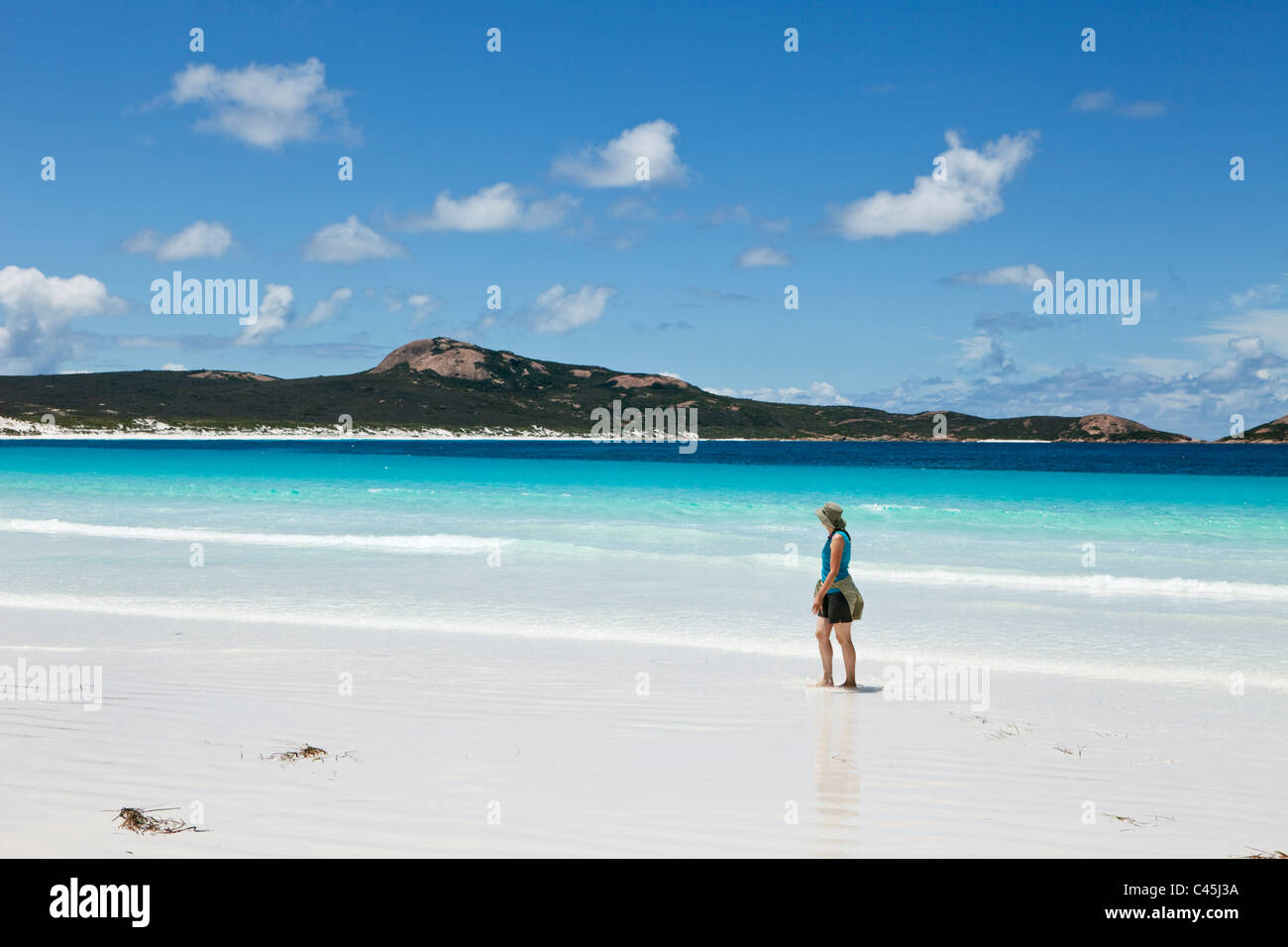 Woman walking along beach at Lucky Bay. Cape Le Grand National Park, Esperance, Western Australia, Australia Stock Photo
