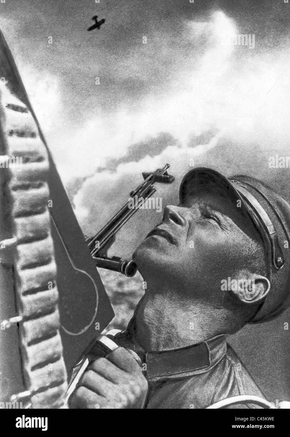 Russian soldier at an anti-aircraft machine gun Stock Photo