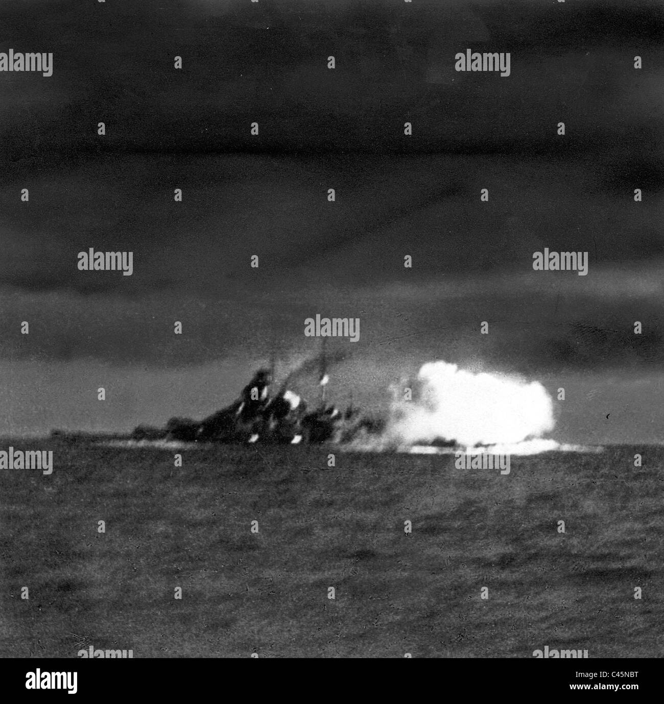 Battleship 'Bismarck' fires at the British battleship 'Hood', 1941 Stock Photo