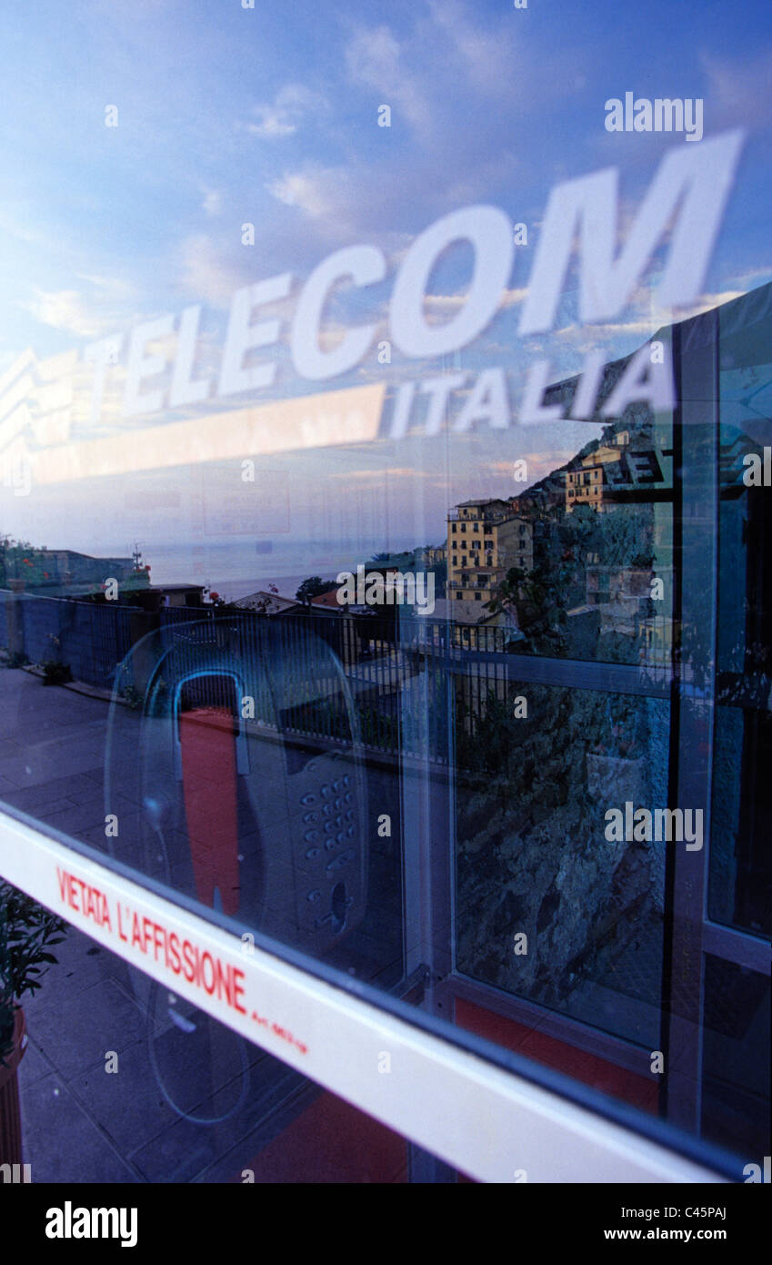 Telekom Italia reflecting the Village of Riomaggiore Cinque Terre, Italy Stock Photo
