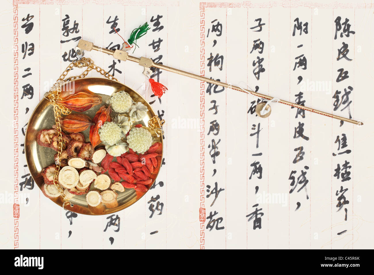 Ingredients for a Chinese medicine formula - Chinese characters are names for the herbs in the formula Stock Photo