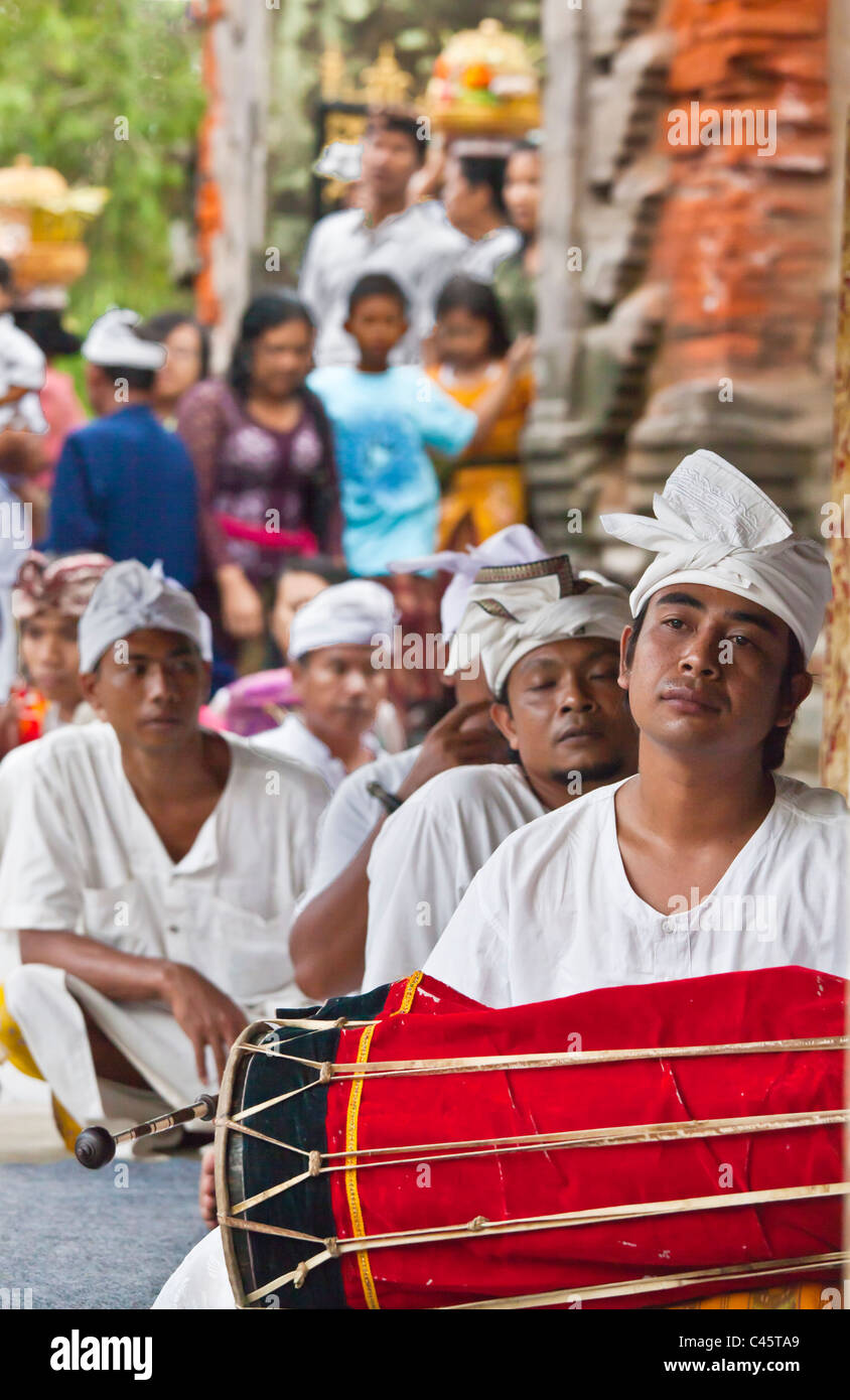 Musicians play a traditional drum at PURA TIRTA EMPUL TEMPLE COMPLEX