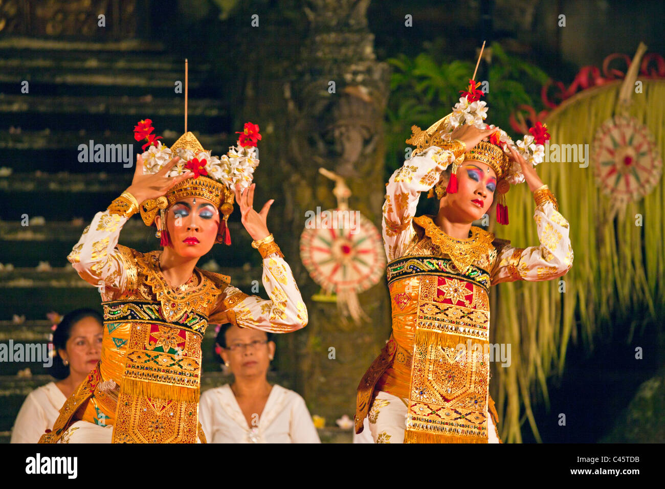 The LEGONG TRANCE DANCE is performed by the Cenik Wayah Gamelan Dance Group at PURA TAMAN SARASWATI - UBUD, BALI, INDONESIA Stock Photo
