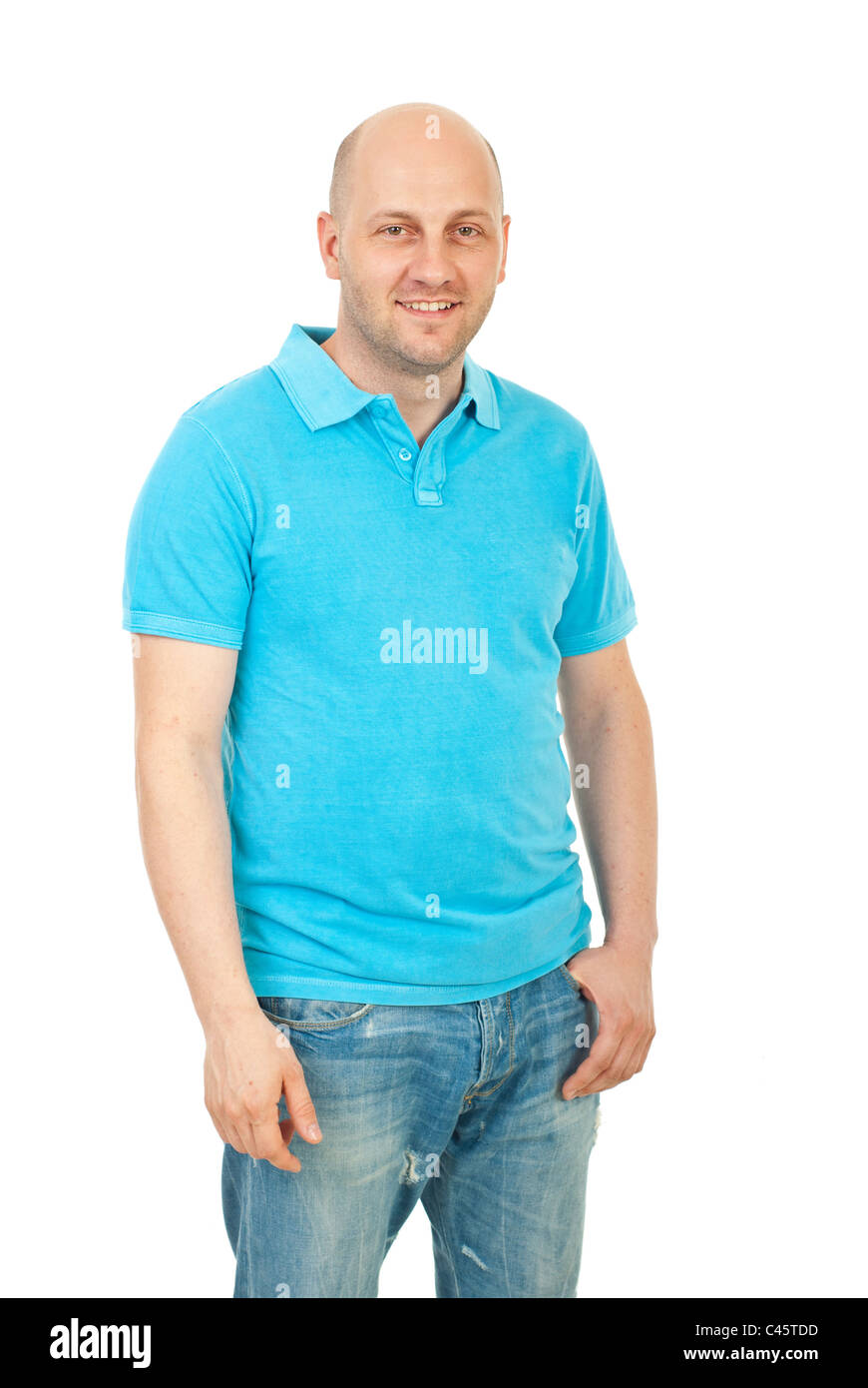 Happy bald guy wearing blank turquoise tshirt and jeans isolated on