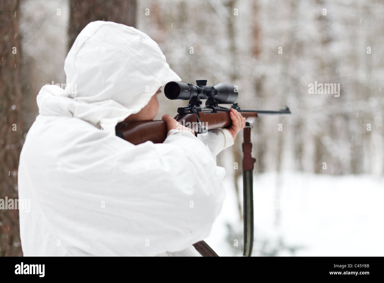 Sniper reload his rifle in forest Stock Photo by ©Nesterenko_Max 89103288